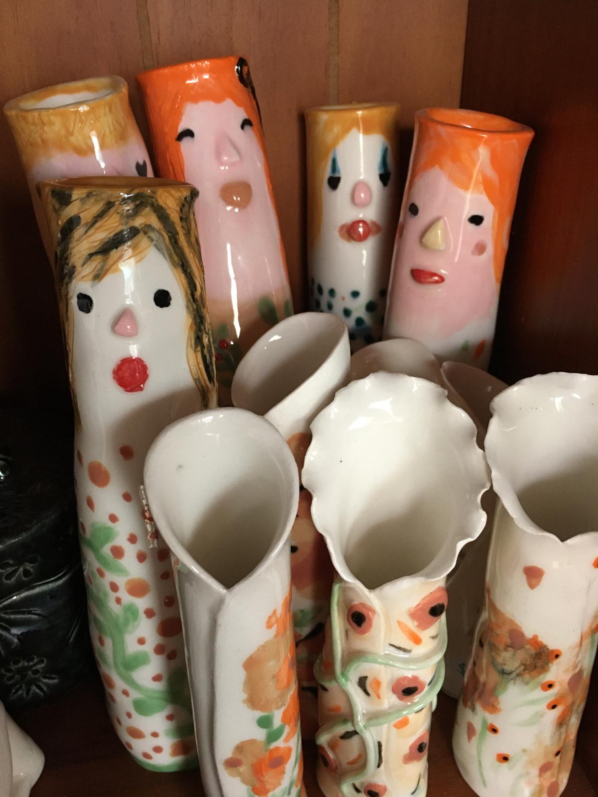Whimsical ceramic face vases